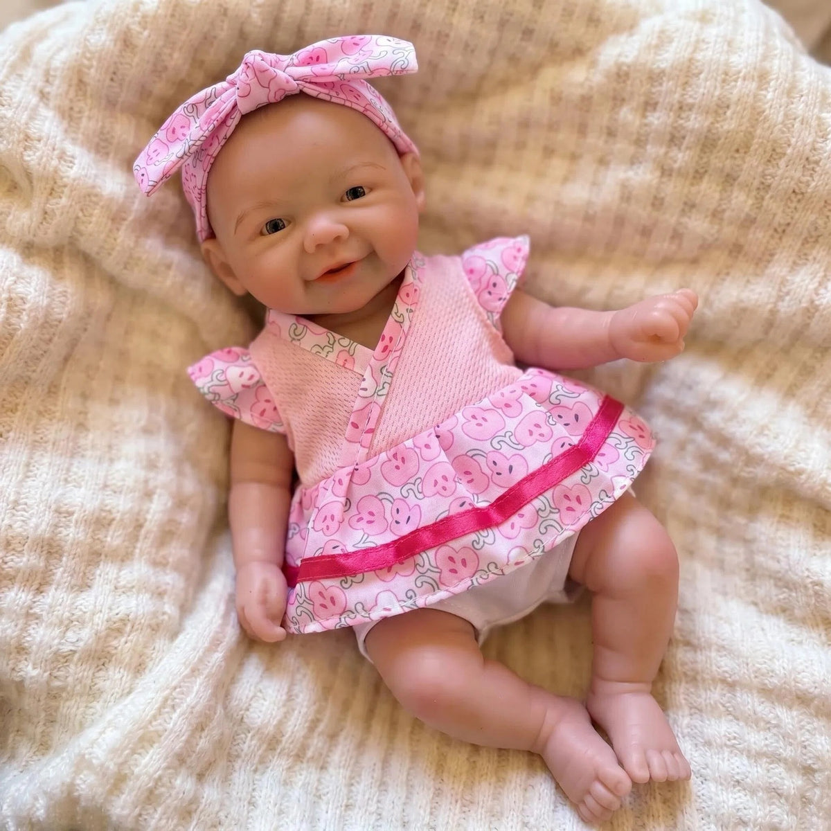 8-Zoll-Reborn-Puppe mit Spitzenärmel-Oberteil in Pink und komplettem Vollsilikonkörper als Weihnachtsgeschenk für Kinder