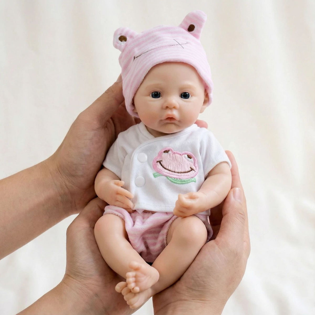 12-Zoll-Reborn-Puppe aus Vollsilikon mit rosa Froschhut für Kinder als Weihnachtsgeschenk